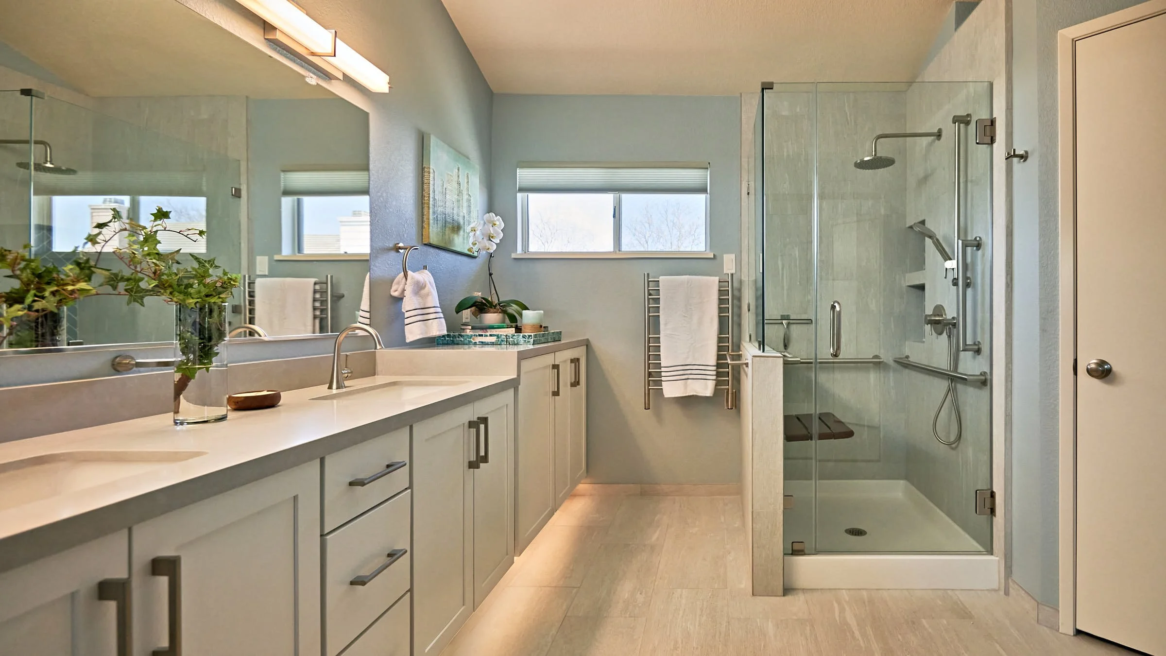 full-service-interior-design-berkeley-ca-factors-in-interior-design-investment-bathroom-with-glass-shower-double-vanity-large-mirror-light-colors.jpg