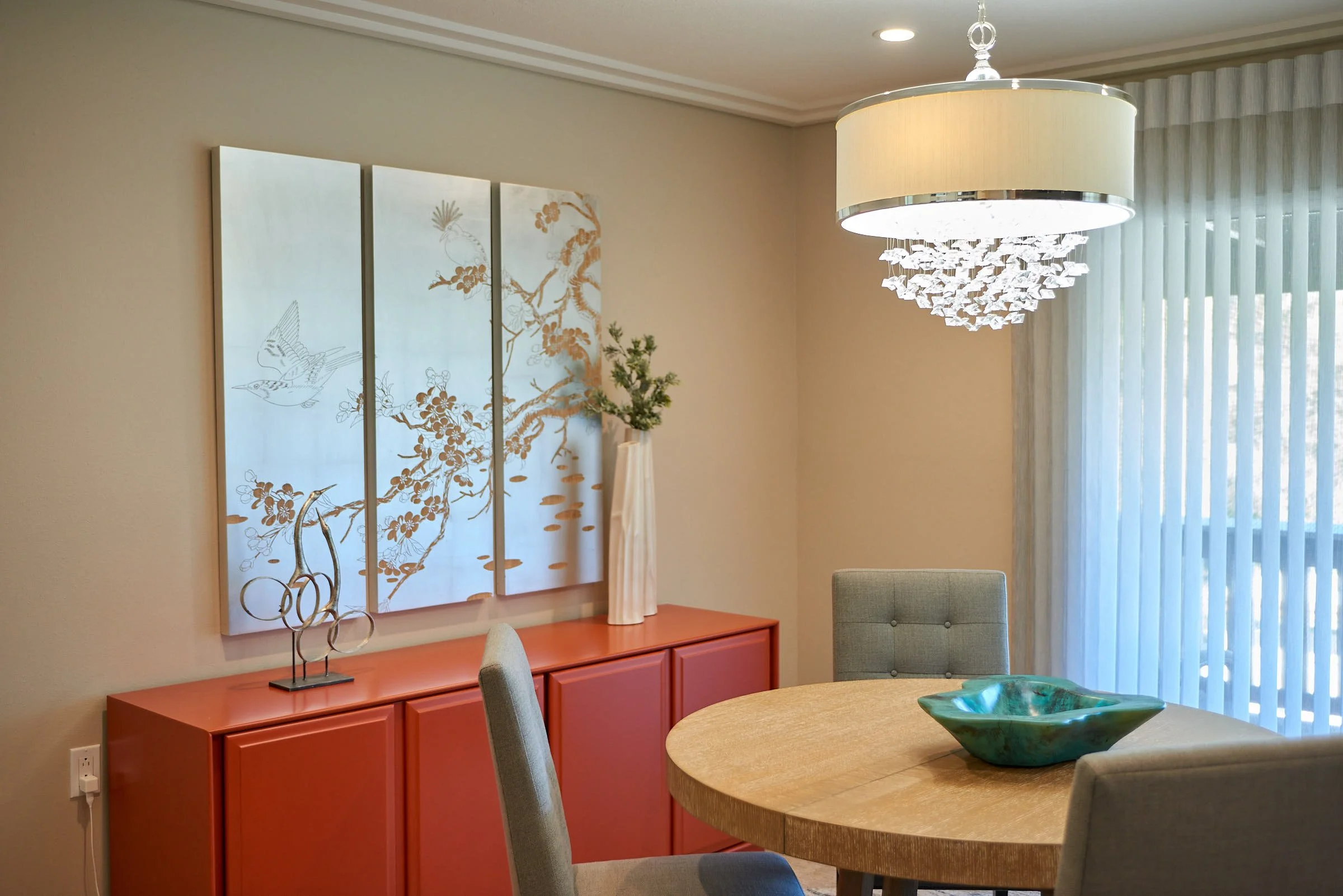 raashi-design-danville-ca-design-details-for-a-finished-space-dining-area-with-small-round-table-red-sideboard-with-floral-art-above-contemporary-virtual.jpg