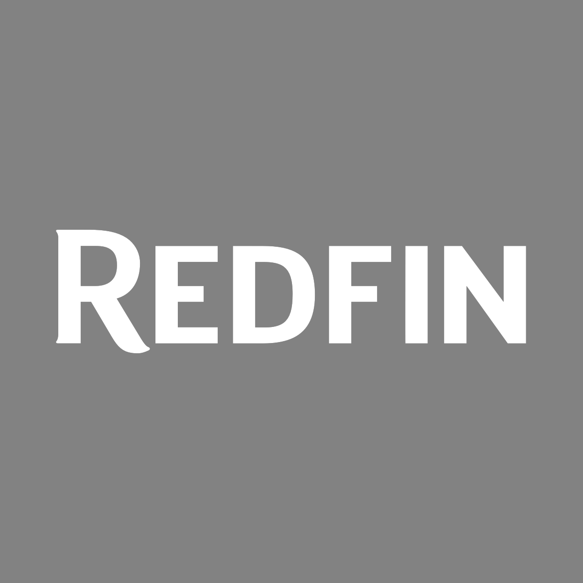 The image features a gray background with the word "REDFIN" written in large, white capital letters centered.