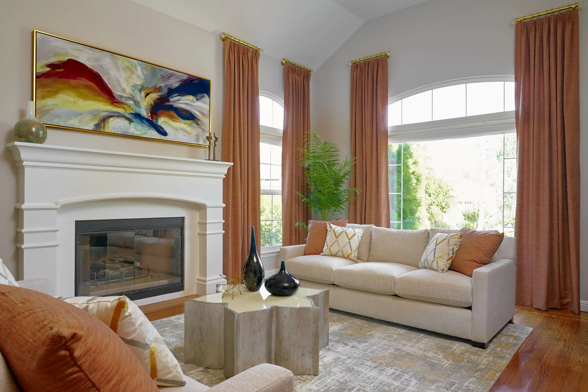 turn-key-residential-interior-design-pleasanton-ca-factors-in-interior-design-investment-living-room-with-deep-orange-accents-custom-drapes-and-sofas.jpg
