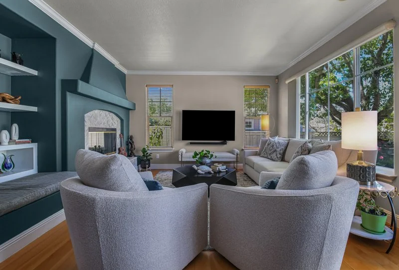 full-service-interior-design-pleasanton-ca-luxury-home-layouts-cozy-living-room-deep-teal-build-in-cabinetry-large-window-delight-design.jpg