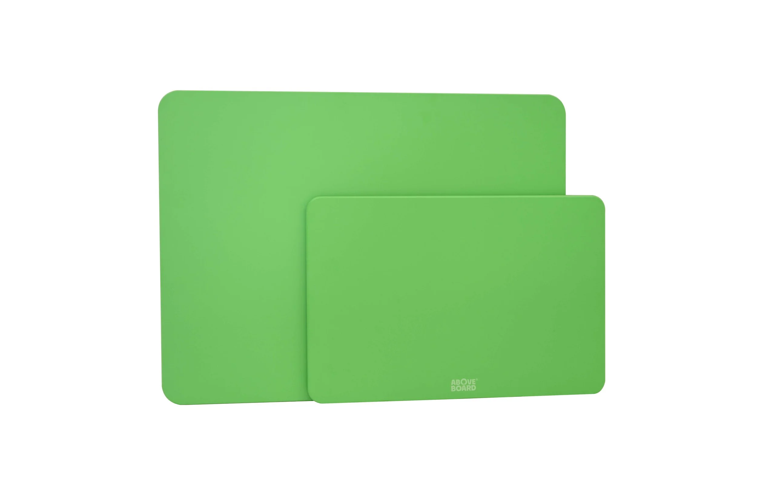 Two green wood-fibre sustainable cutting boards of different sizes stacked together on a white background.