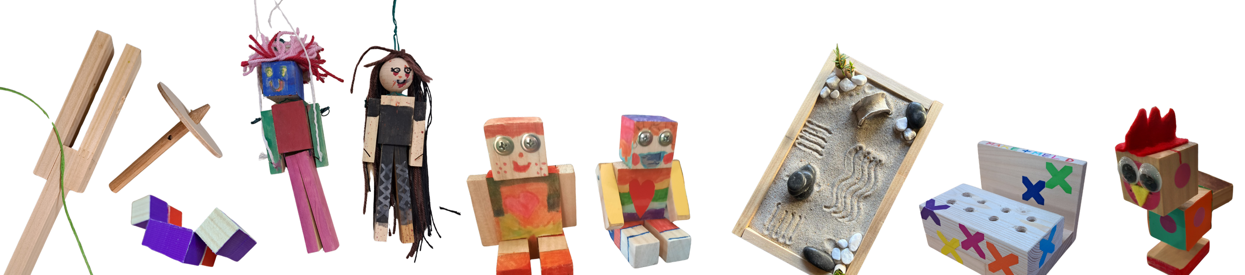 Collection of handmade toys, including wooden blocks, dolls, and miniature objects, arranged in a row.