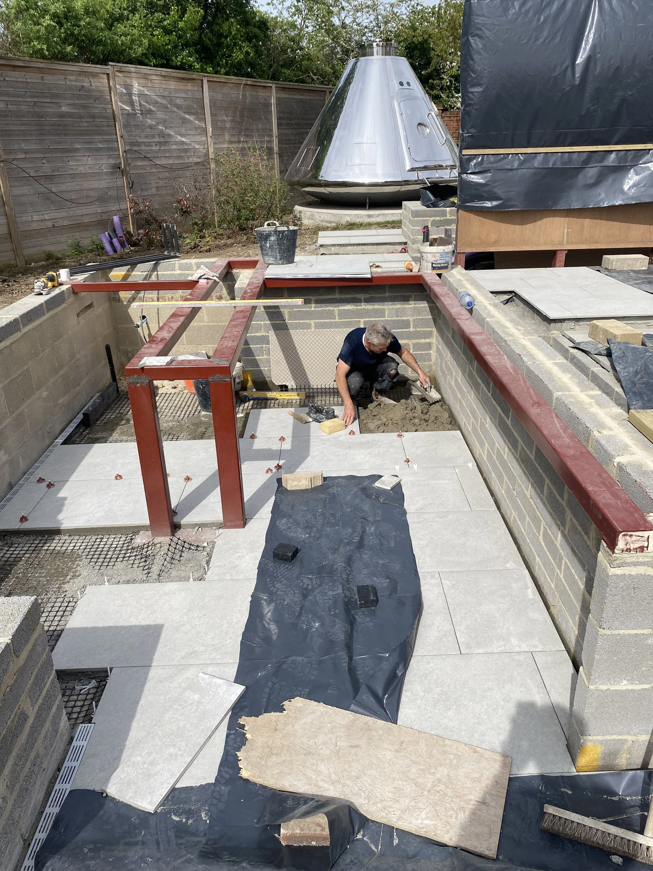 laying paving beneath bar