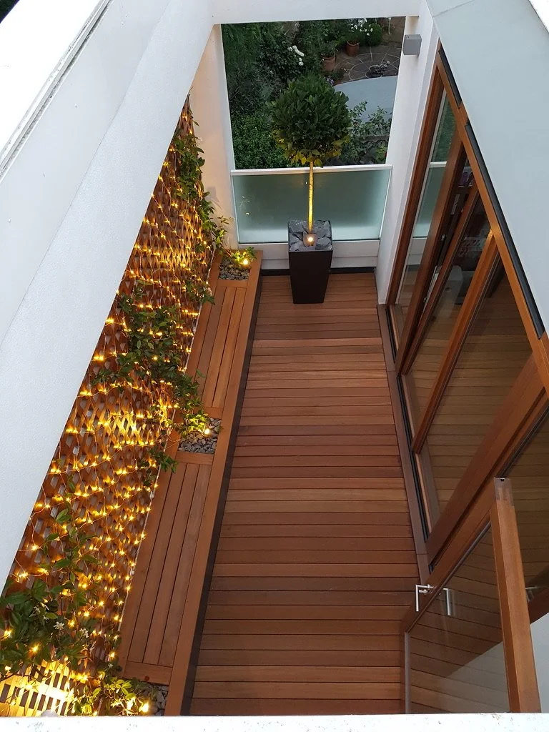 narrow roof balcony garden at night 