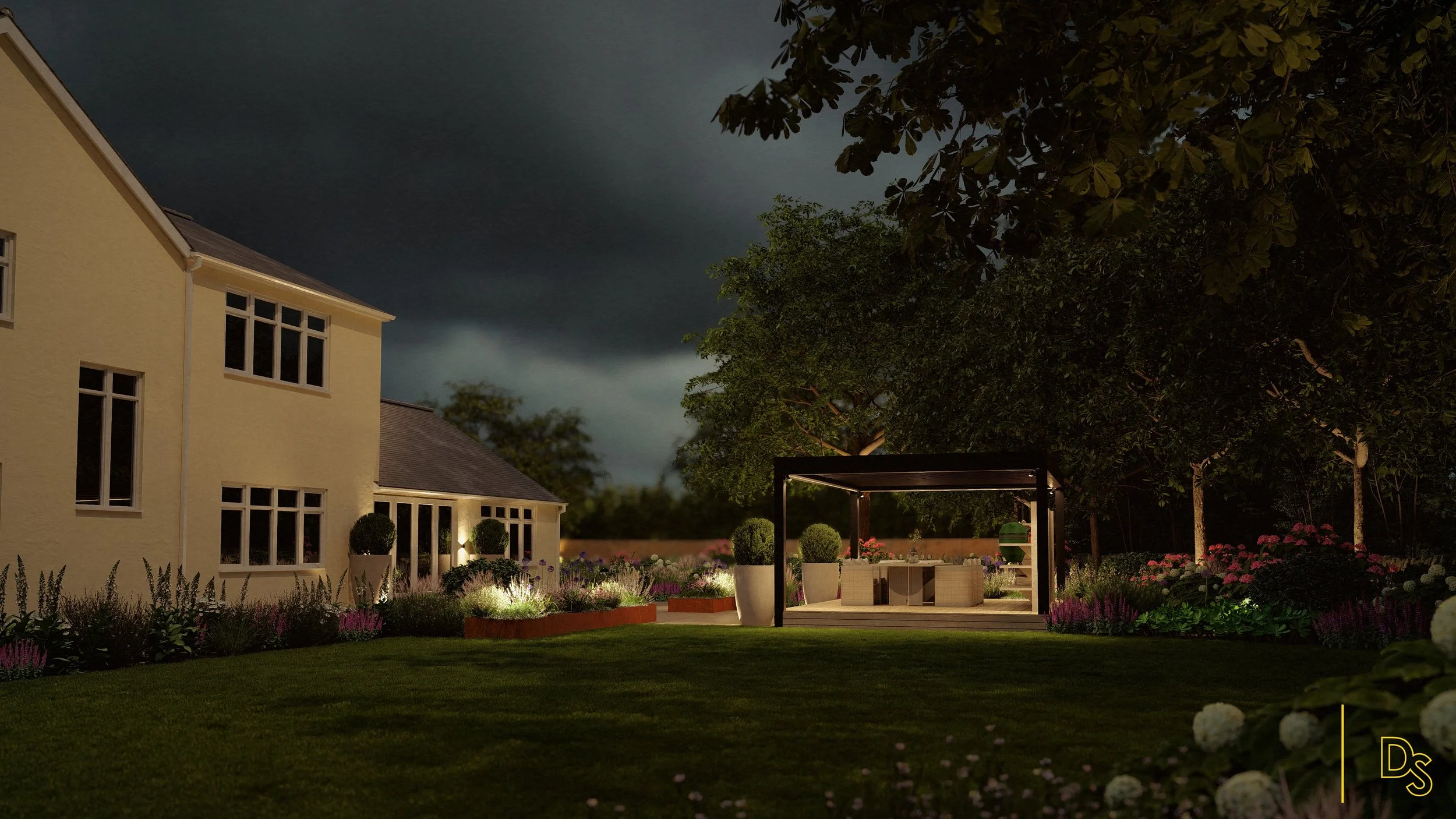 Nighttime view of a residential backyard with a yellow house on the left, illuminated garden beds, a patio area with outdoor furniture, a covered pergola, and trees in the background under dark, stormy skies.