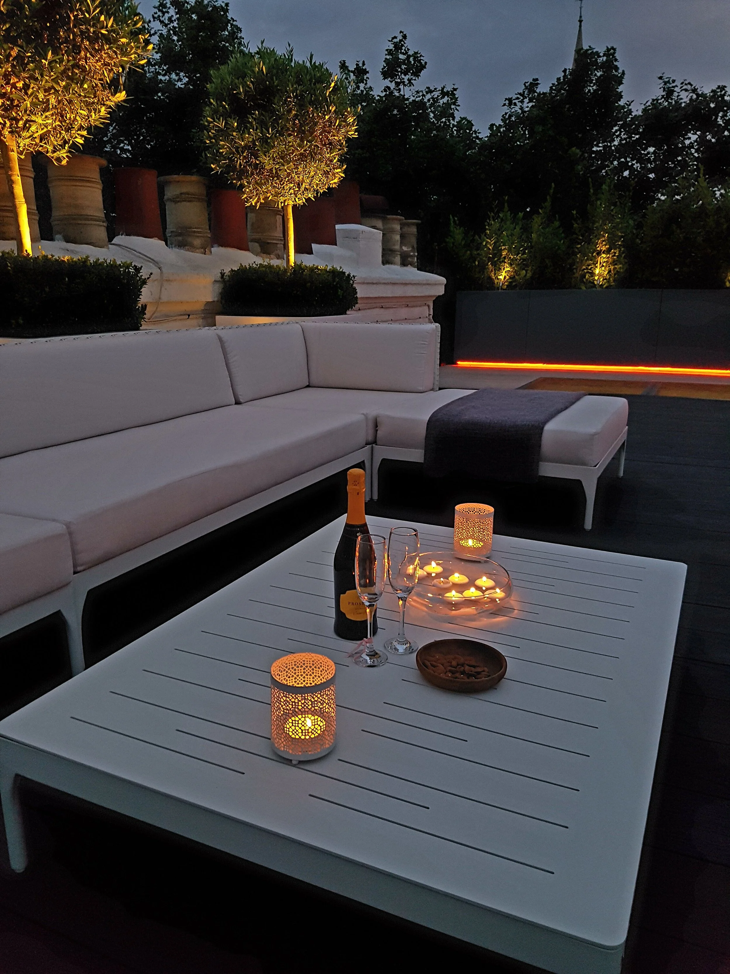 rooftop lounge area at night 