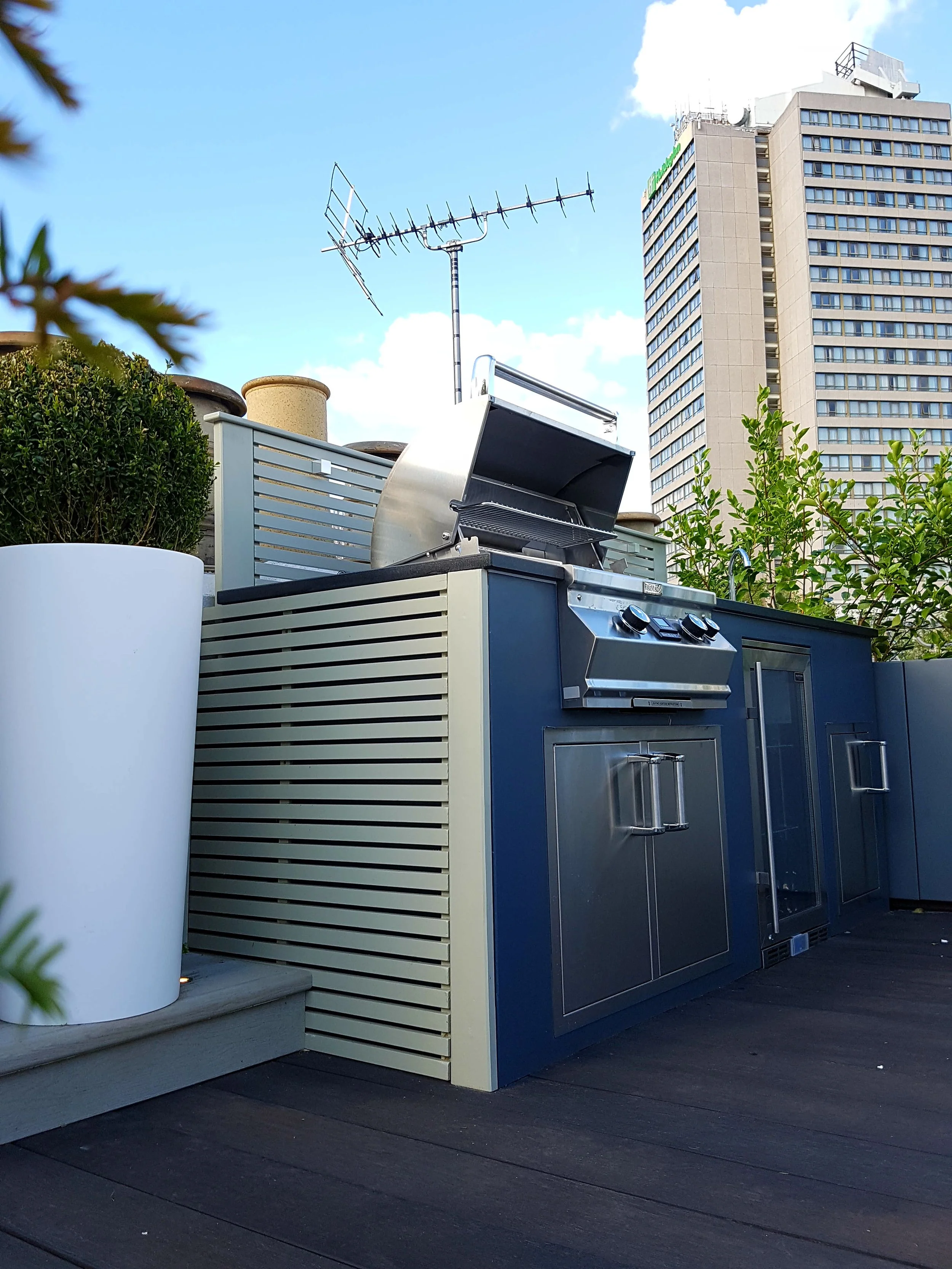 outdoor kitchen with planter