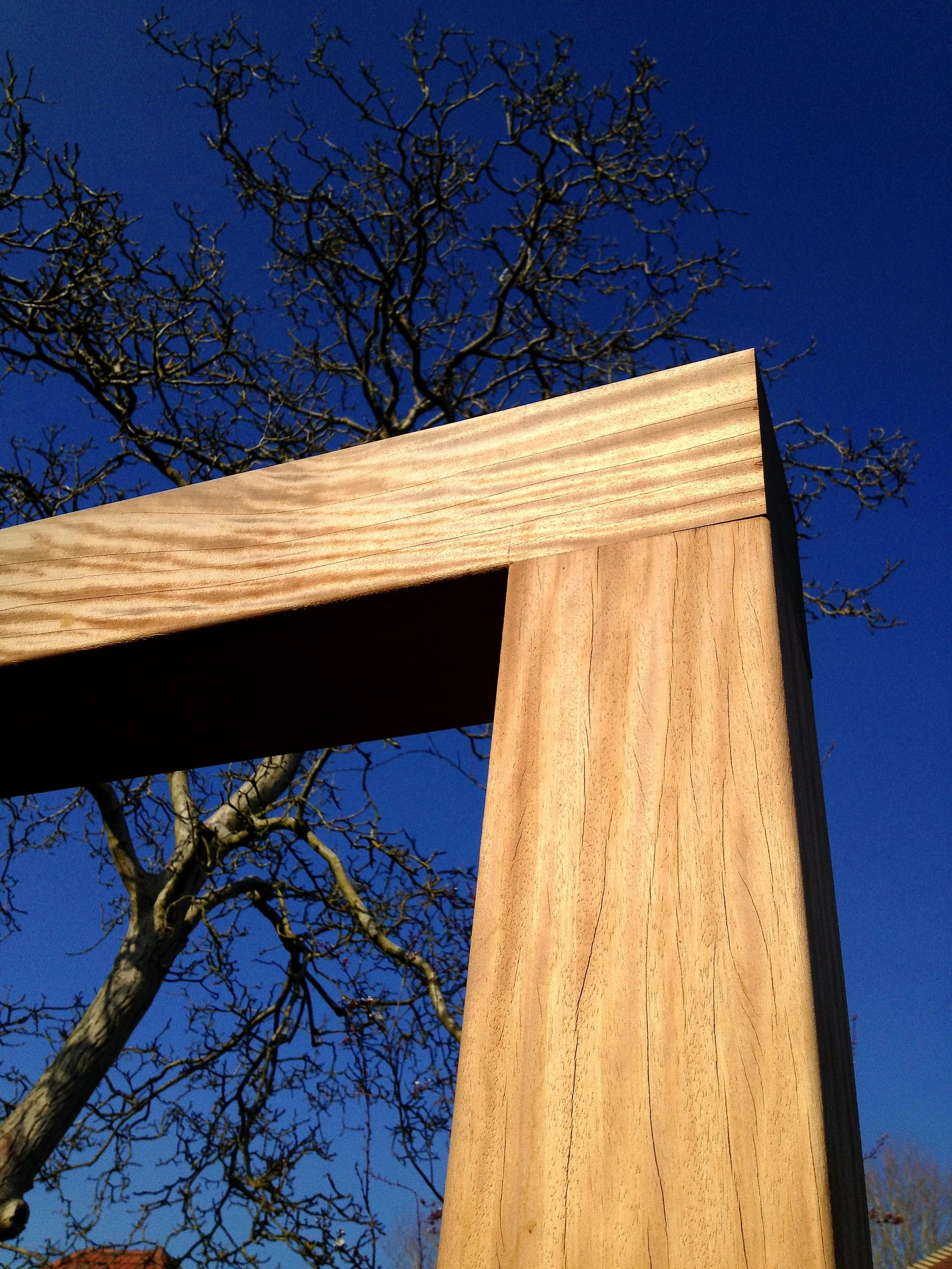 hardwood timber garden structure with deep blue sky