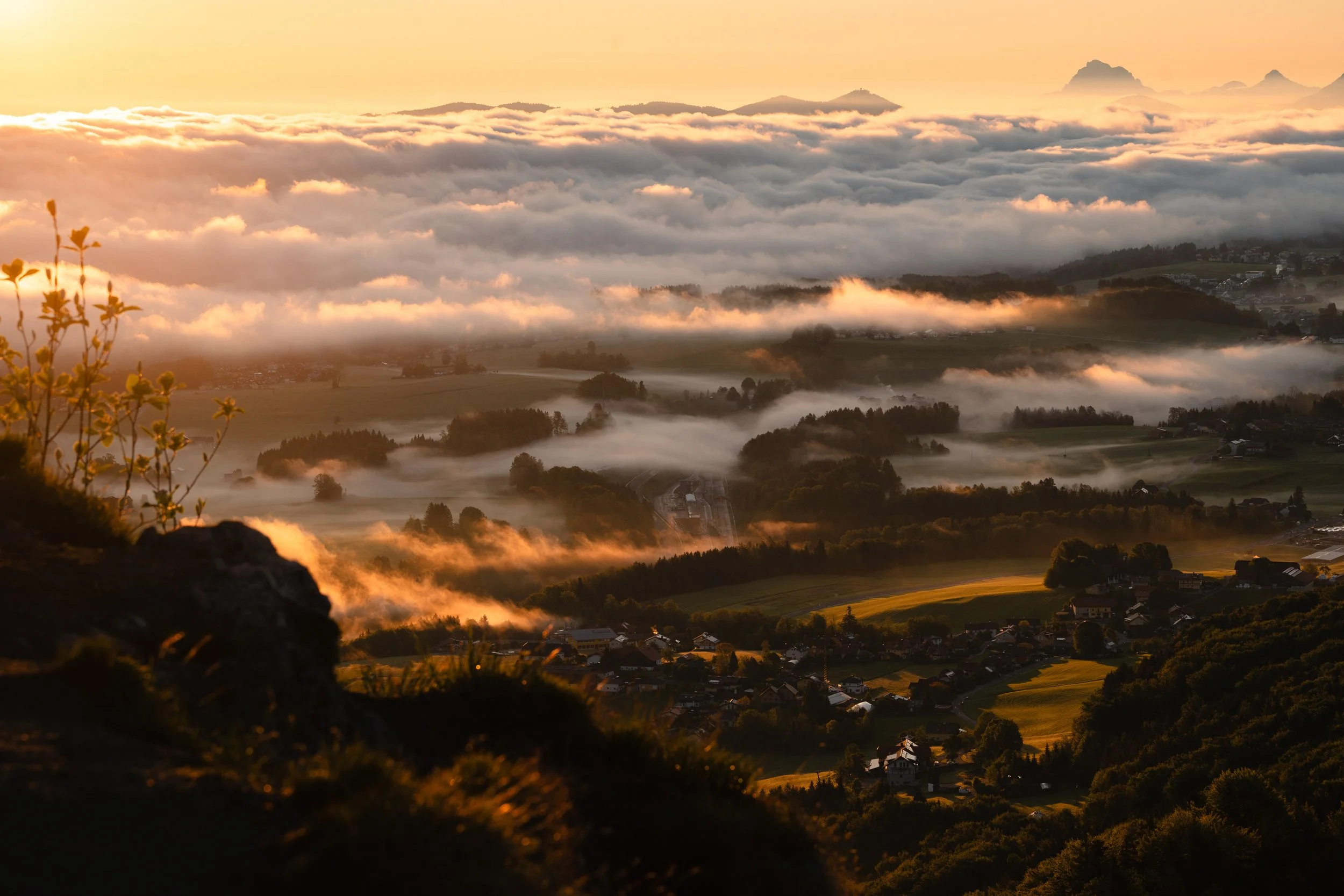 Sunrise from Nockstein Salzburg with warm sunlight and fog in the walley