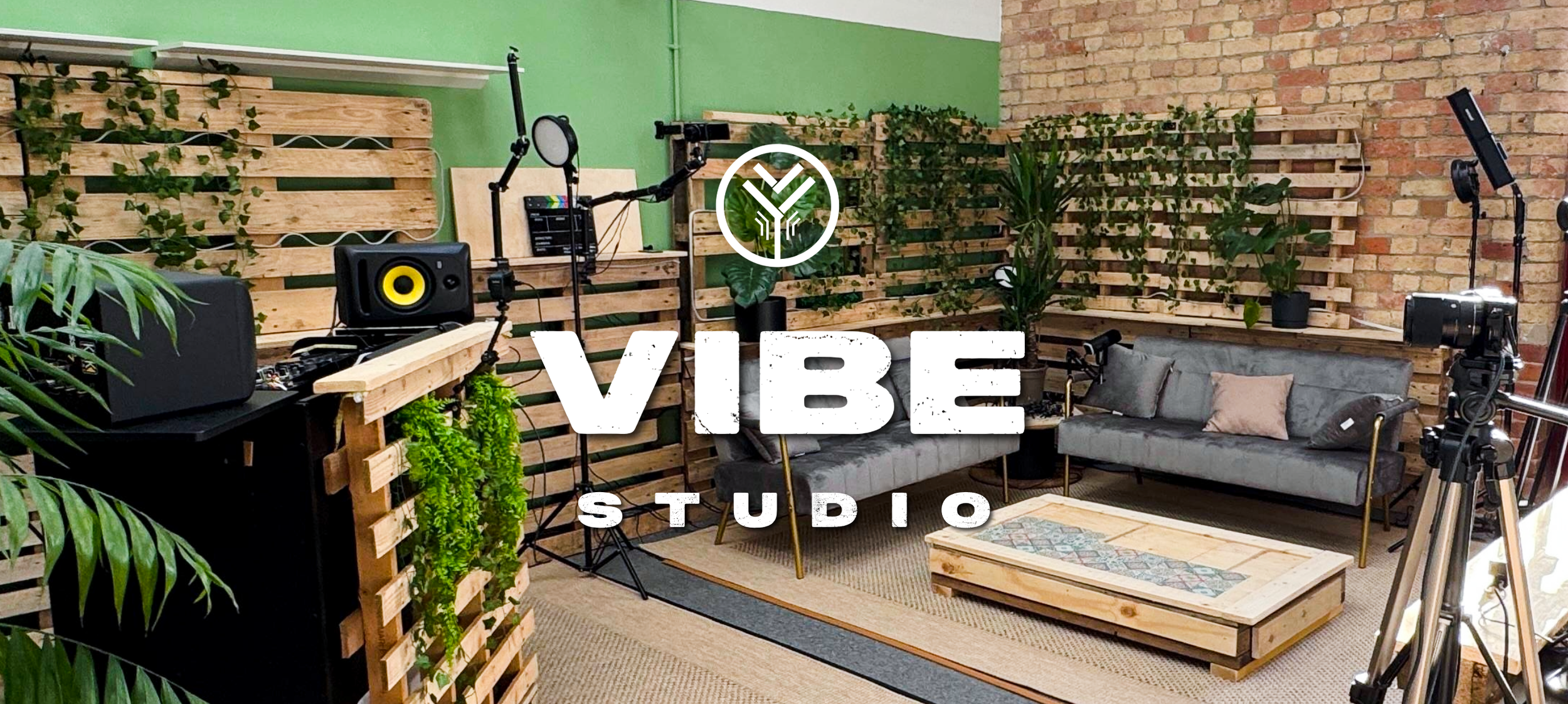 VIBE Studio Derby podcast and video room with cameras, lighting and sofa