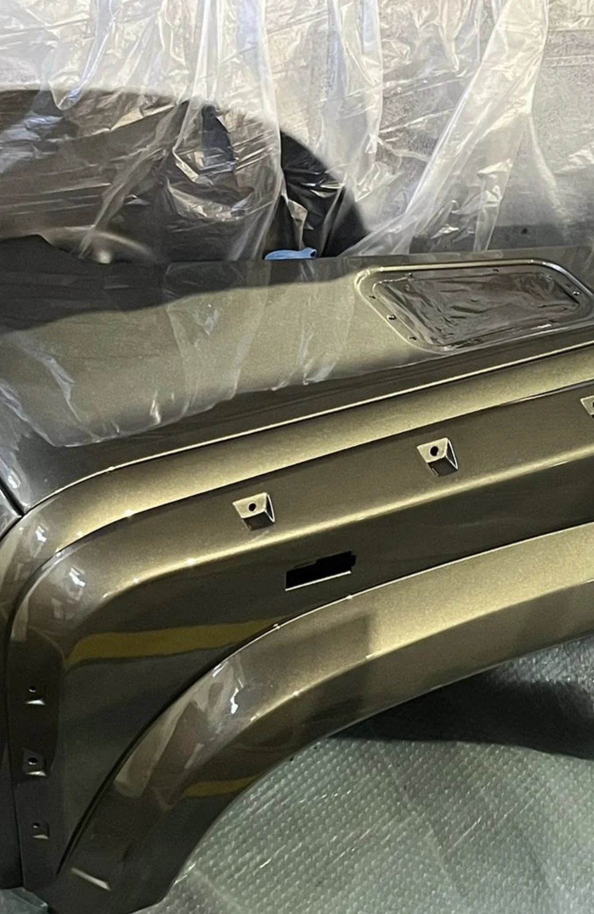 Painting the Project Kahn wide body kit for a Land rover Defender.