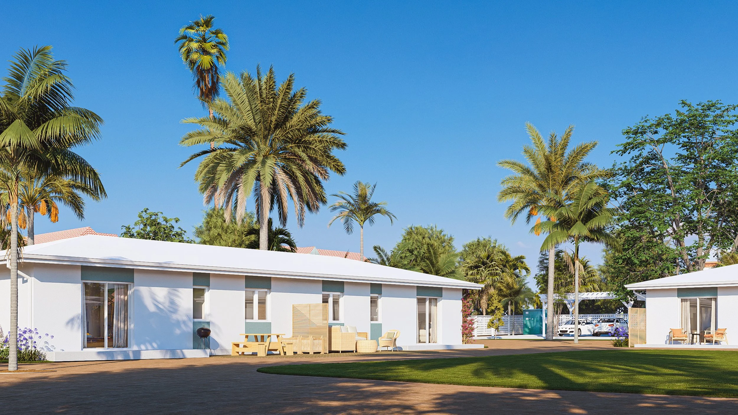 A row of Bauhu hurricane resistant modular houses with outdoor seating, palms, and green trees under a clear blue sky.