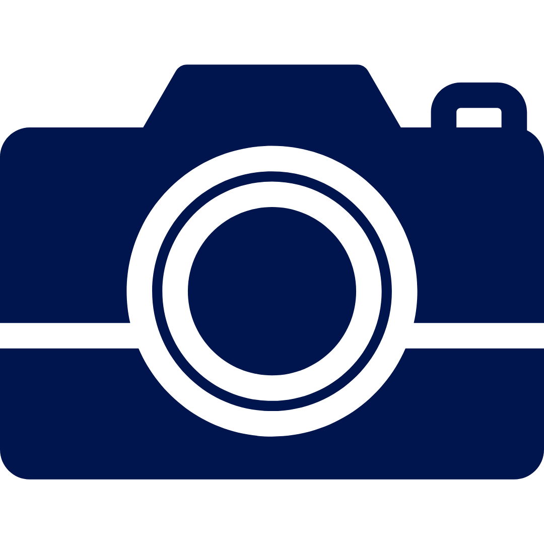 Icon of a digital camera with a large lens in the center, depicted in dark blue and black.