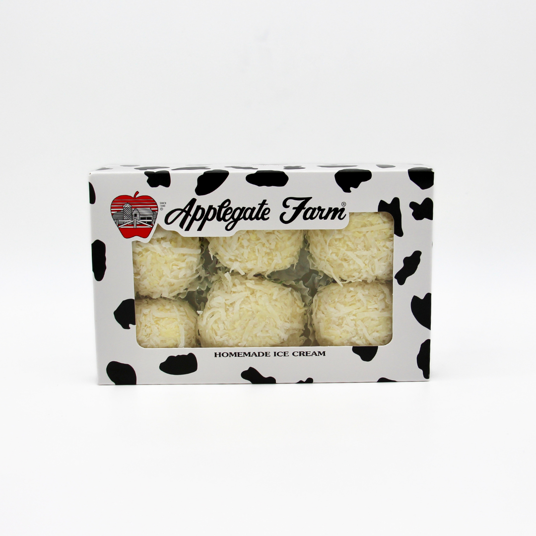 Package of Applegate Farm homemade ice cream with six white ice cream truffles covered in shredded cheese or coconut in a cow print box with a transparent window.