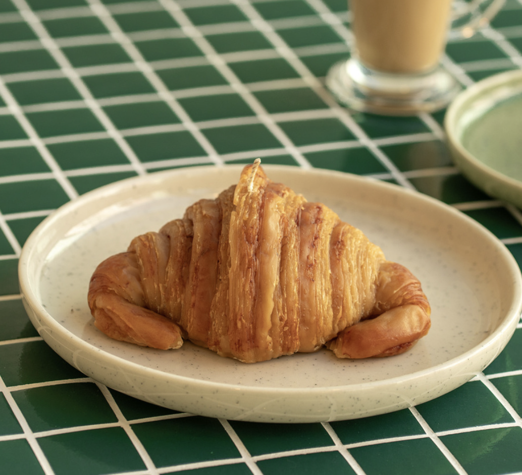 Croissant-shaped beeswax candle
