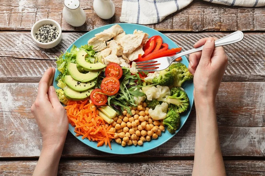 Colorful anti-inflammatory meal with lean protein, avocado, chickpeas, and vegetables