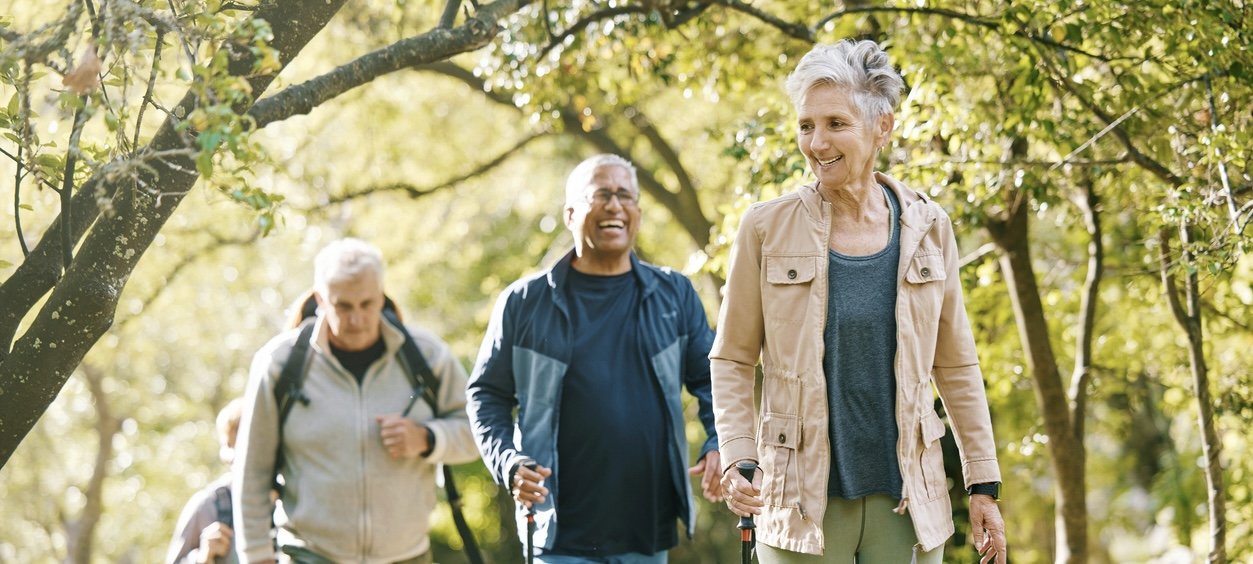 Older adults walking outdoors, following BE CLEAR Guide bronchiectasis tips
