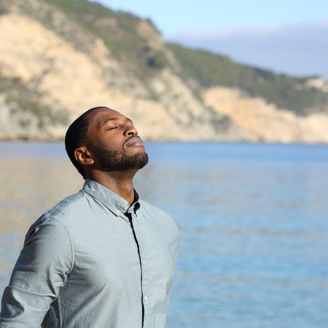 Man with head tilted back taking a deep breath, demonstrating relaxed, open airway breathing