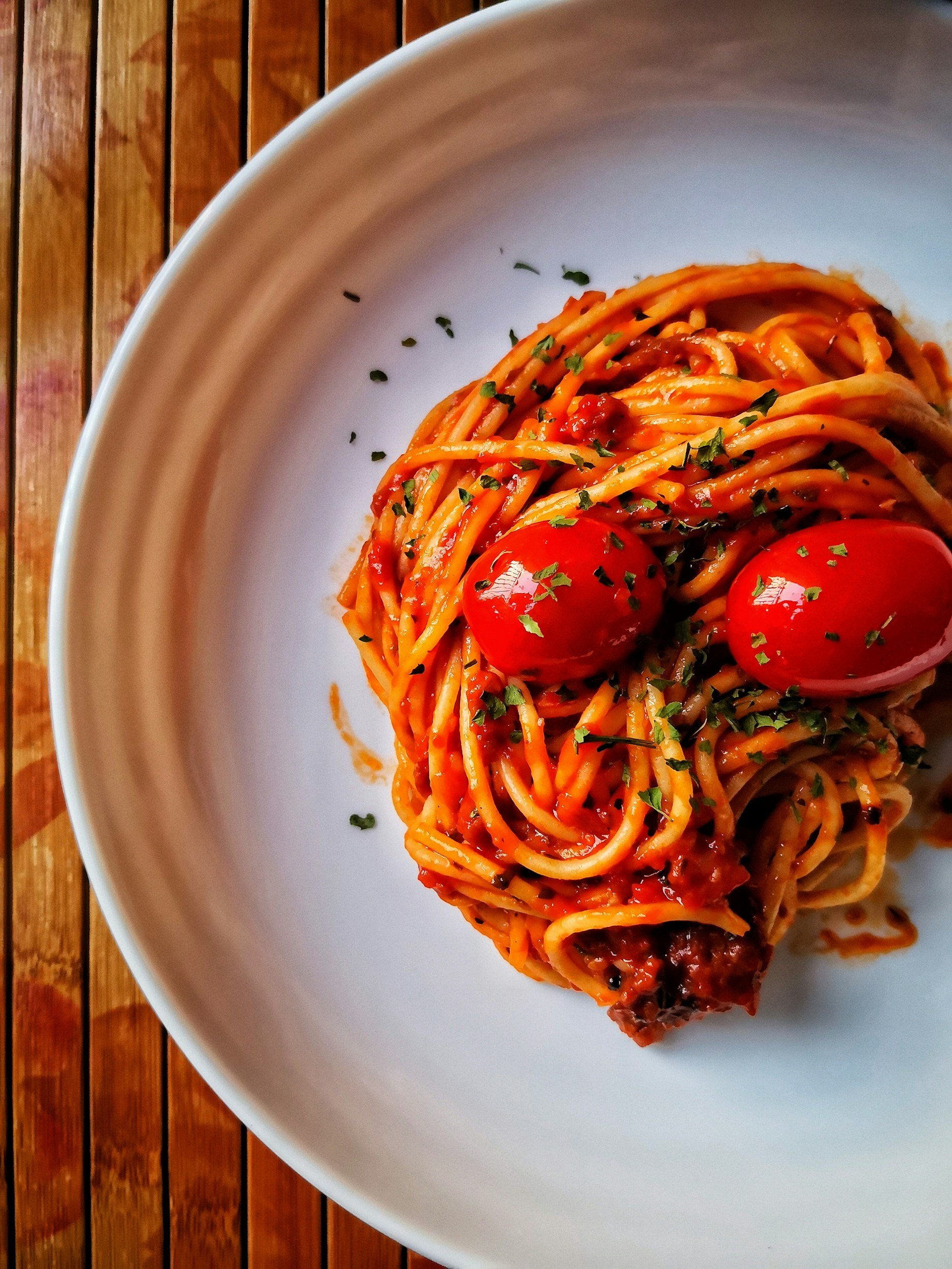Tomato-based pasta dish, a common food that can trigger LPR reflux and reactivate pepsin