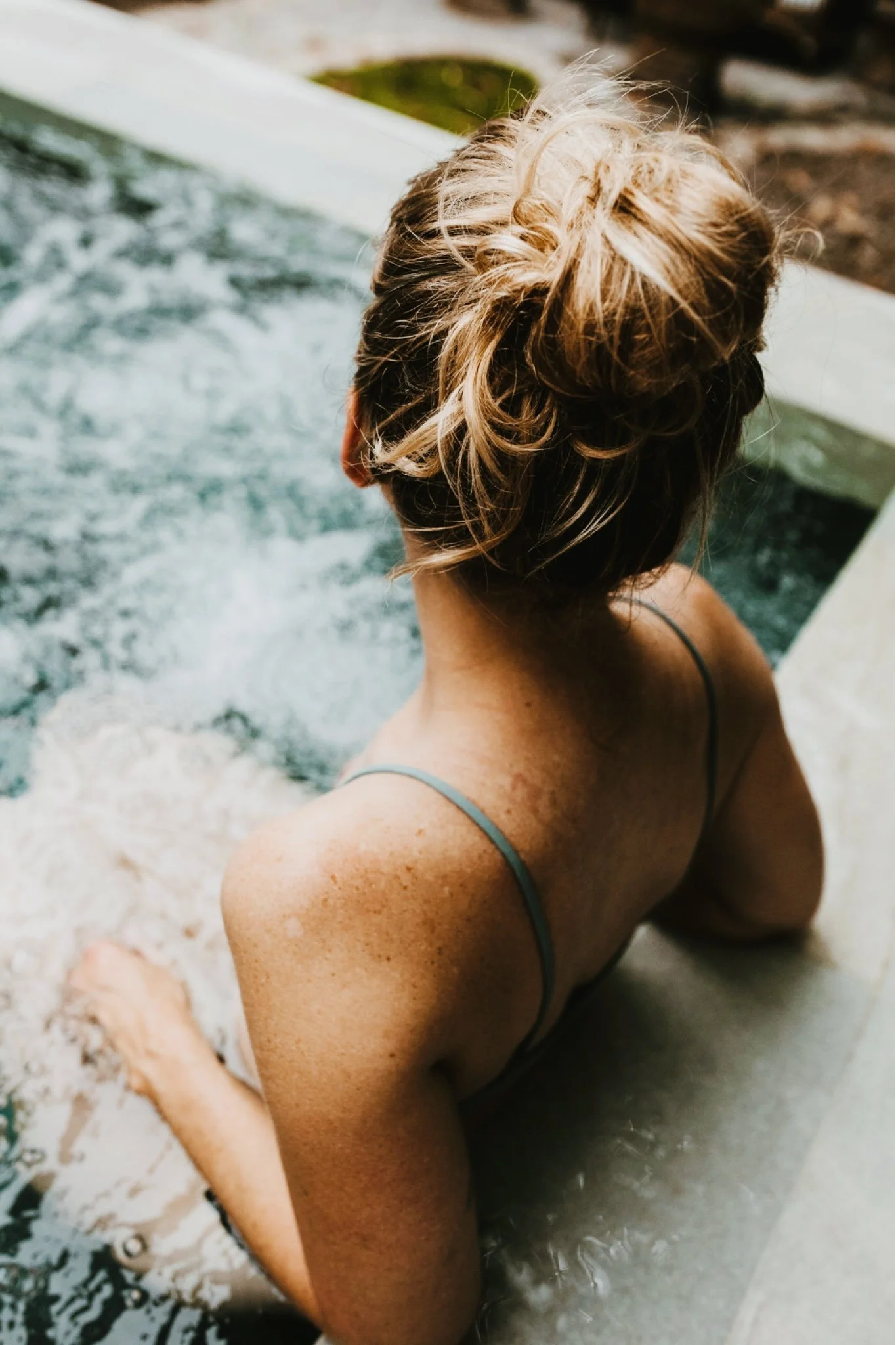 blonde woman in a hot tub