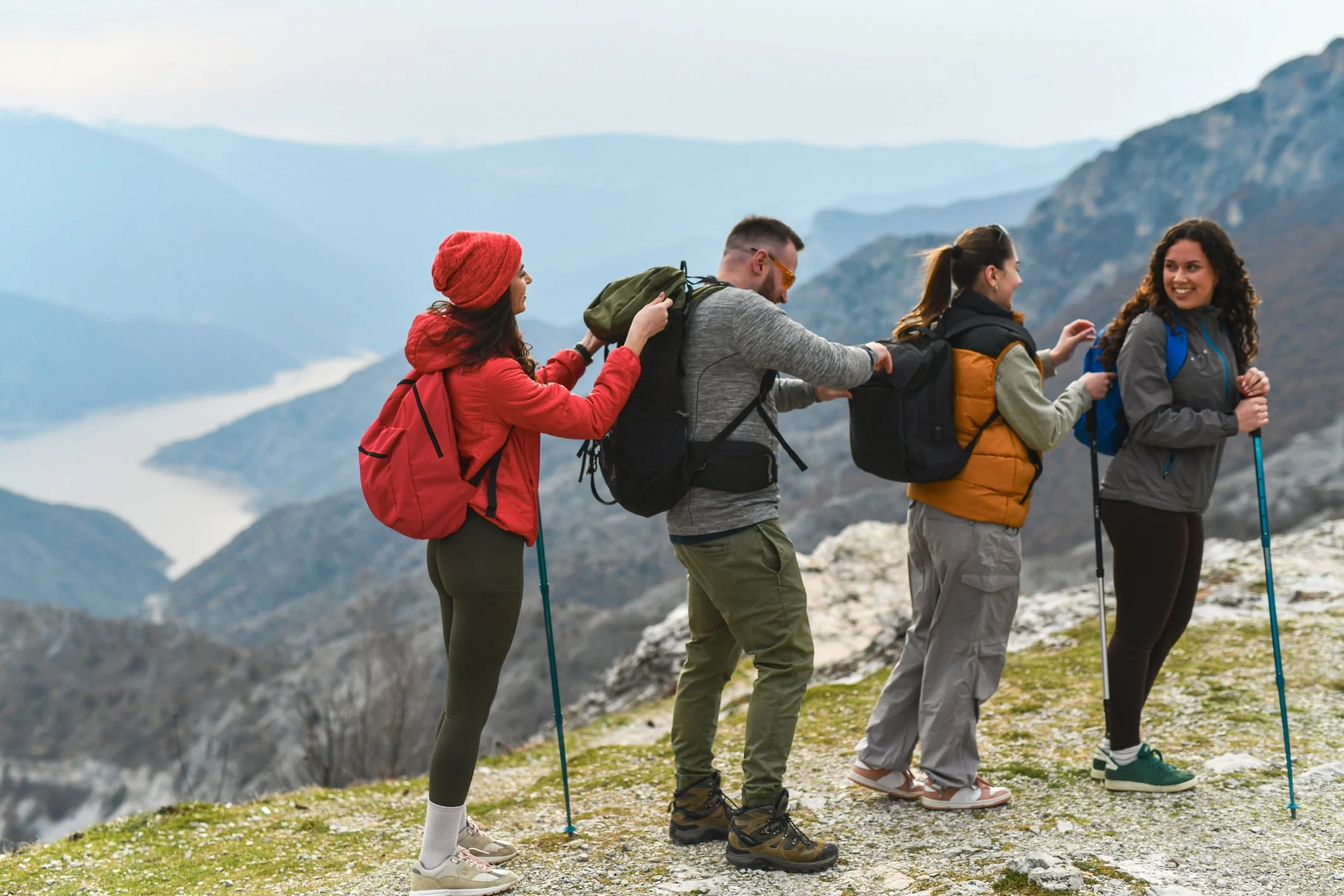 BE CLEAR Toolkit™ card Hikers with poles and backpacks staying active with bronchiectasis