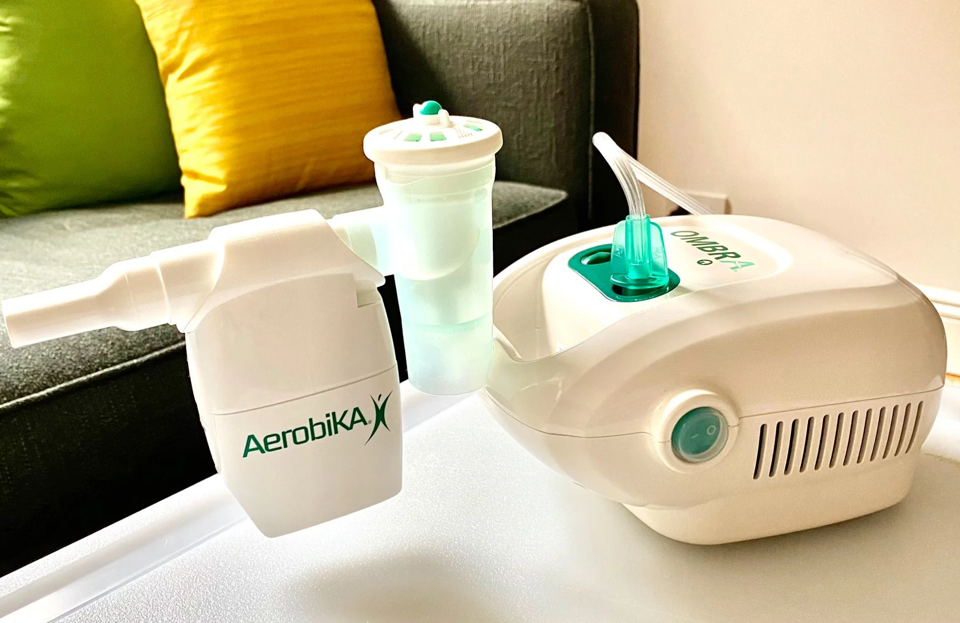 Aerobika OPEP airway clearance device attached to an AeroEclipse nebulizer and Ombra compressor for effective mucus clearance in bronchiectasis
