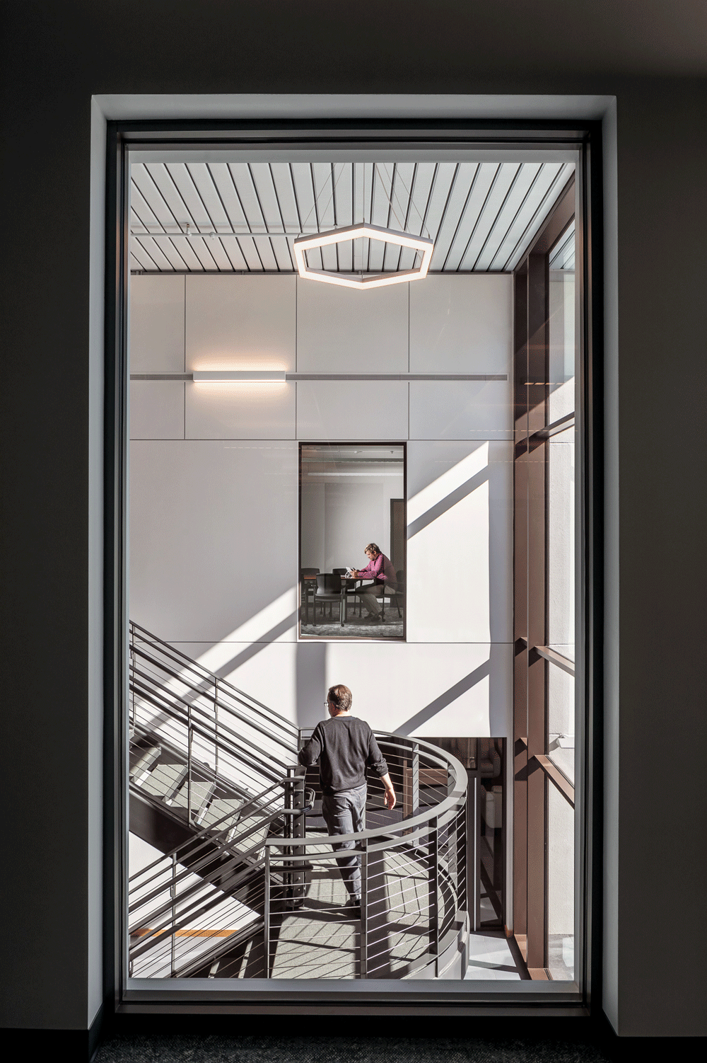 Employees in staircase and office space in ASHRAE Headquarters