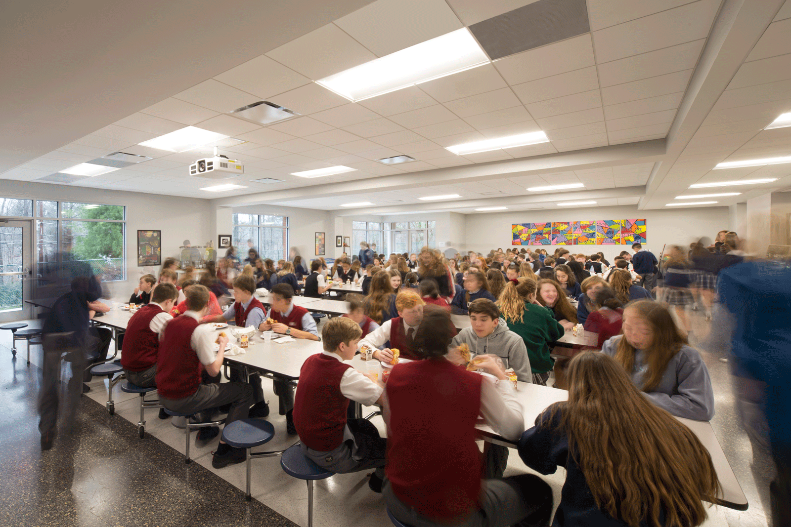 Students in modern and bright cafeteria