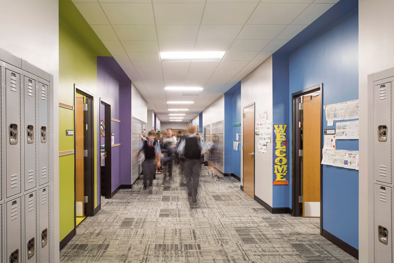 Middle school education building hallway with modern design and bright colors and lights