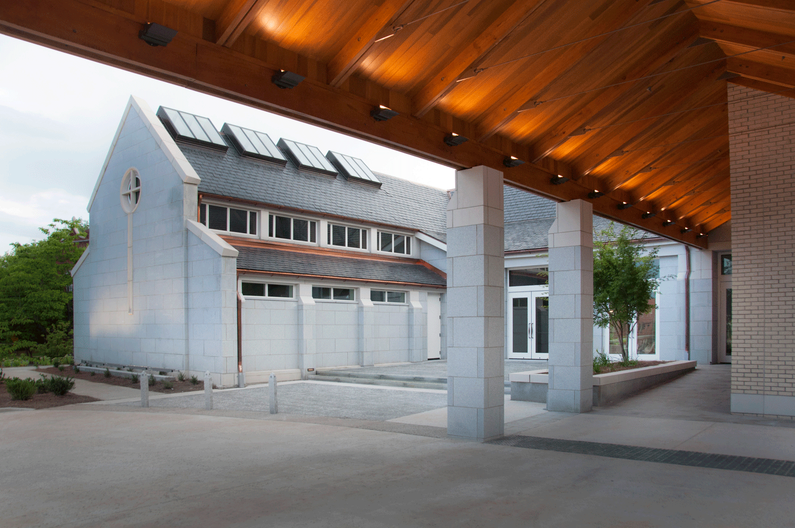 Exterior corridor of church addition featuring warm and cool tone textures