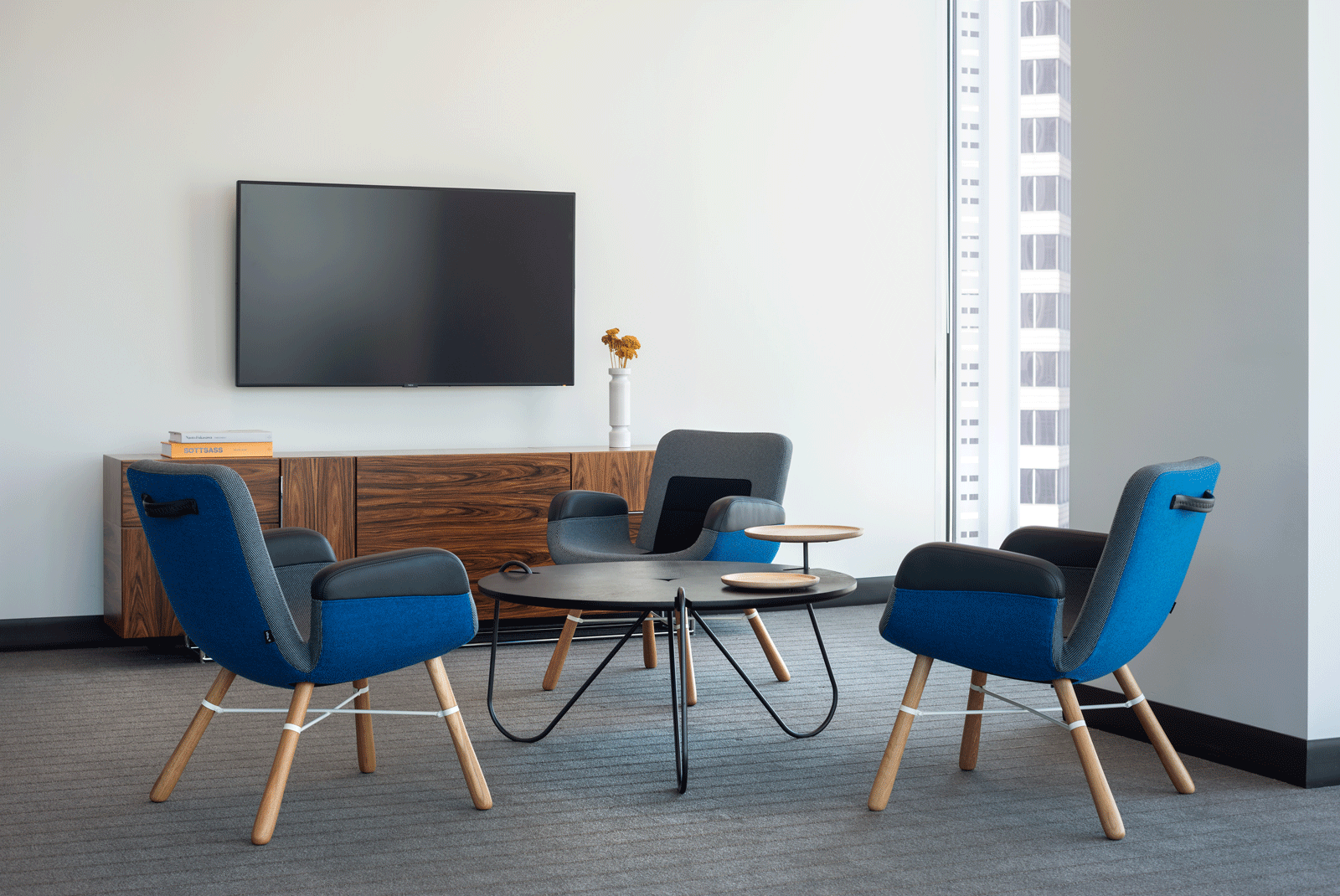 Modern and minimalist custom designed table and chairs with integrated technology