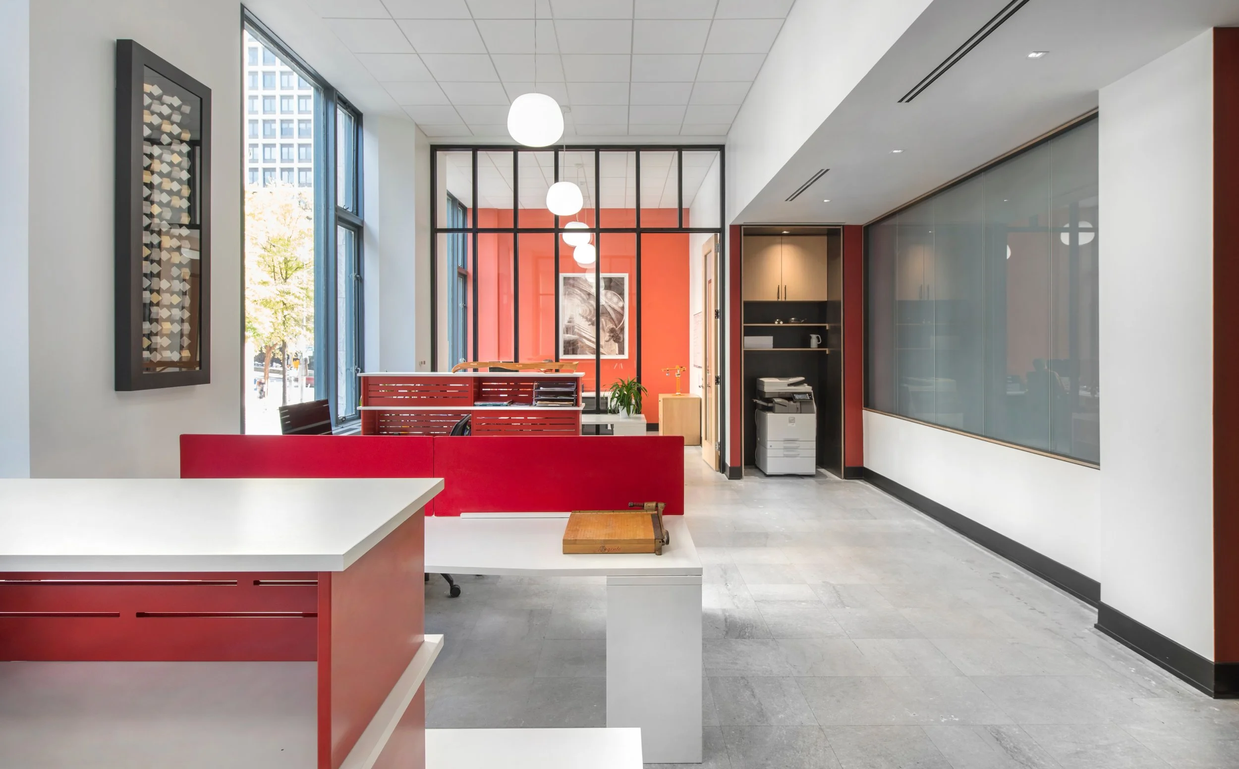 Ground floor office space with open concept work areas and flexible meeting space and large windows with natural light