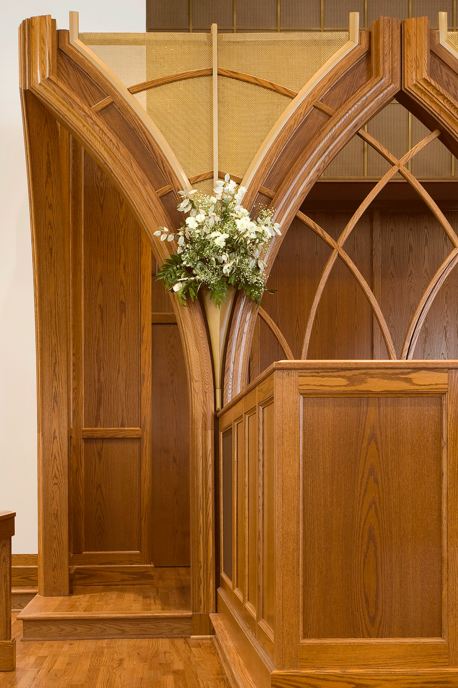 Flowers in built-in vase at church altar