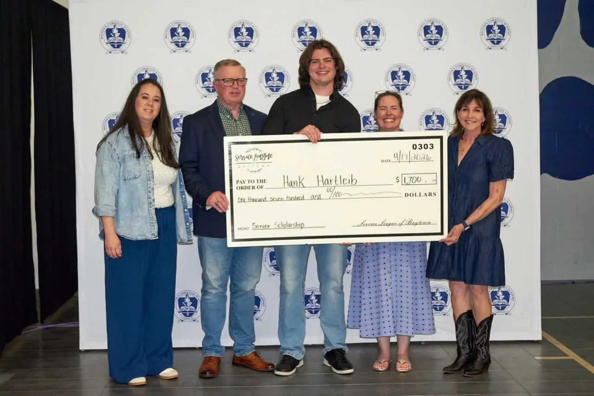 Non-profit community service and philanthropy organization gifting a scholarship to a high school senior