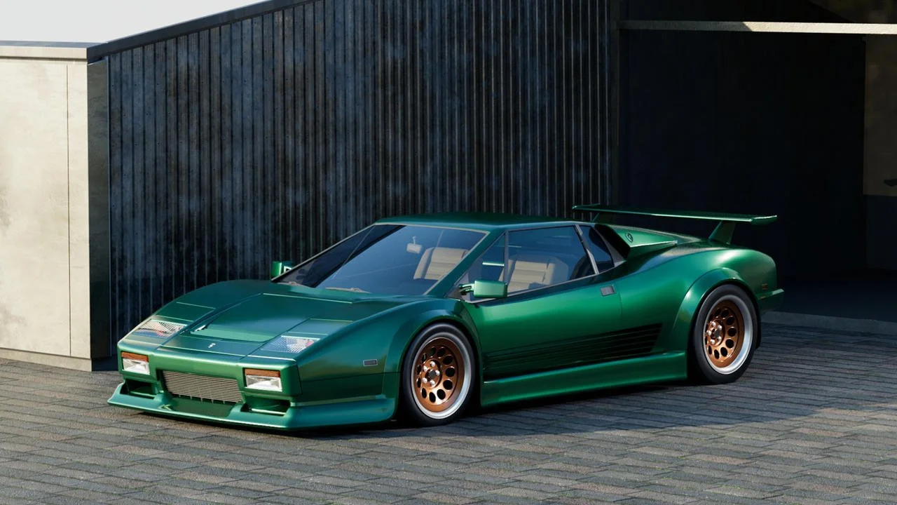 Green vintage racing car with a large rear spoiler parked on a driveway.
