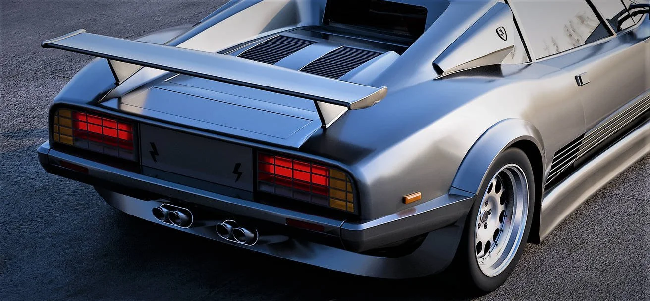 Silver sports car with rear spoiler, quad exhaust tips, and vintage design elements, parked on a dark surface.