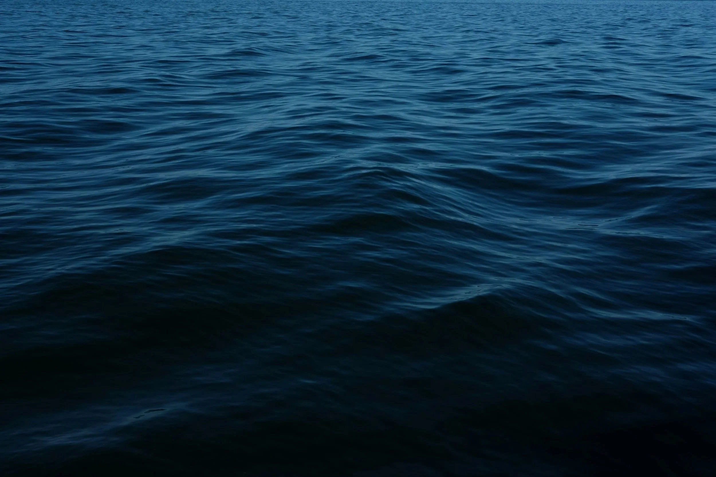 Open ocean water with gentle waves.