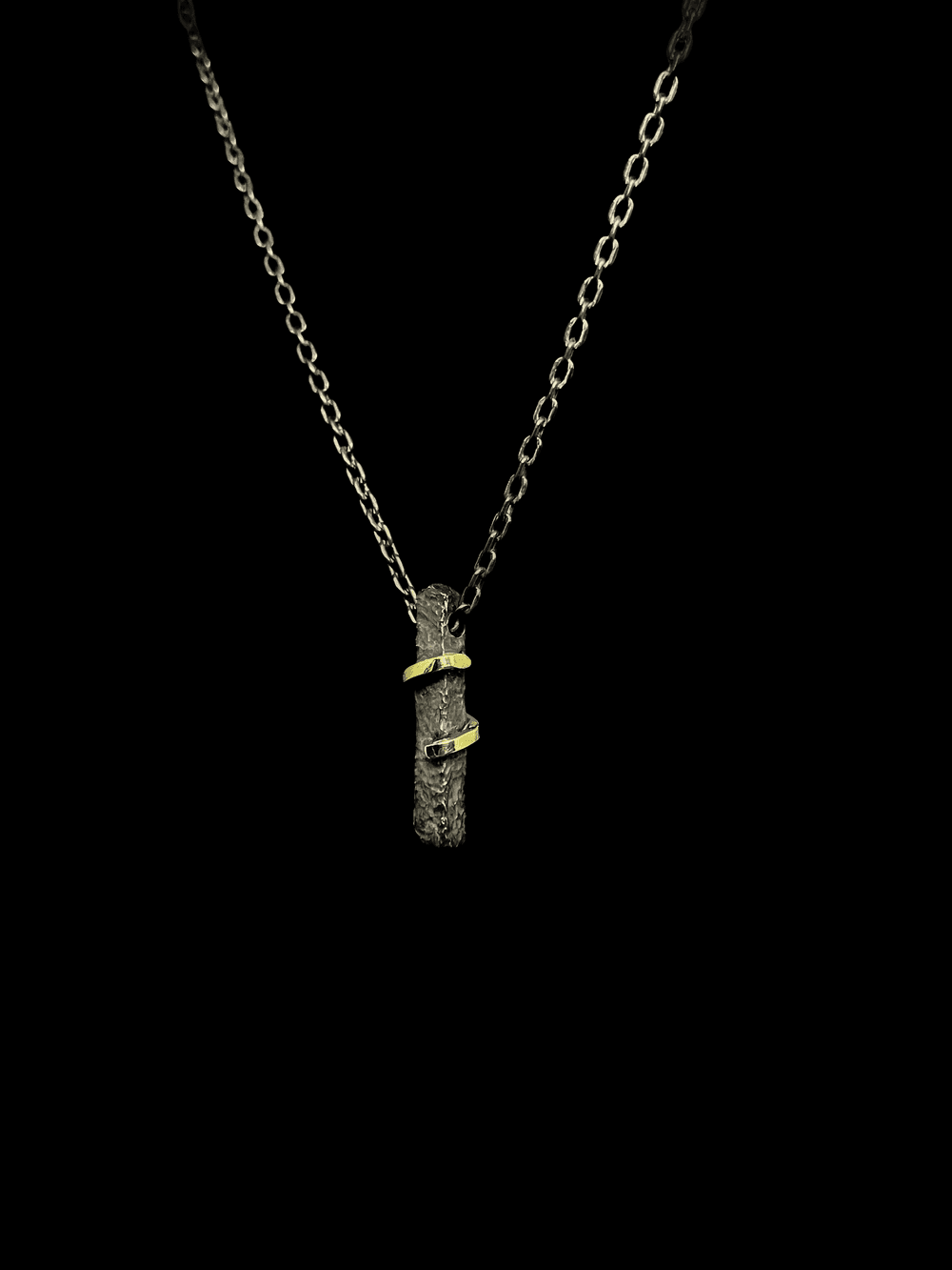 I embrace myself, a forged silver pendant wrapped with gold thread