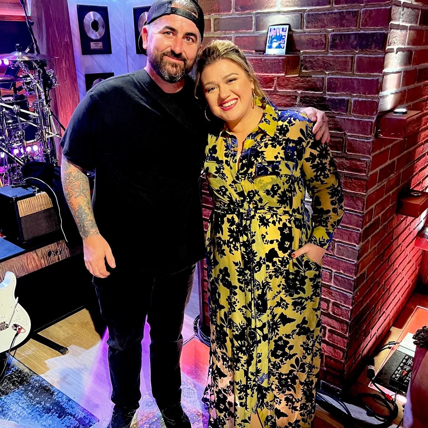 Fischtank and Kelly Clarkson posing together after they performed "Black Hole Sun" live on The Kelly Clarkson Show.