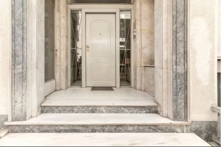 Residential front door with glass sidelights and marble steps Greece, Investment, Golden Visa, Real Estate, Cyprus, Georgia, Lebanon, LPI, Athens.