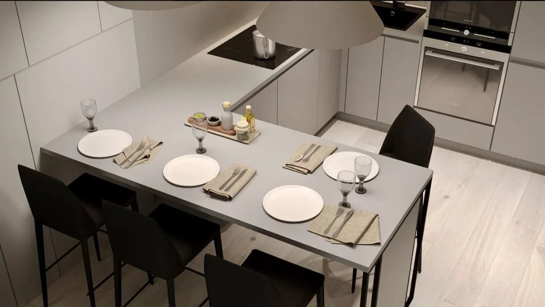 Modern kitchen with a dining table set for four, including plates, glassware, and napkins, with built-in appliances and light-colored flooring.