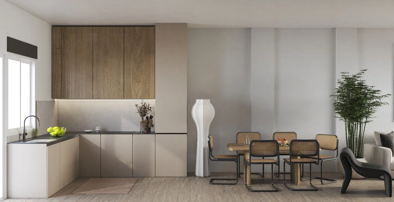 Modern kitchen and dining area with light wood cabinets, a black countertop, a bowl of green apples, a vase with flowers, a tall white floor lamp, a wooden dining table with six chairs, a large potted plant, and a white sofa with a black chair in the