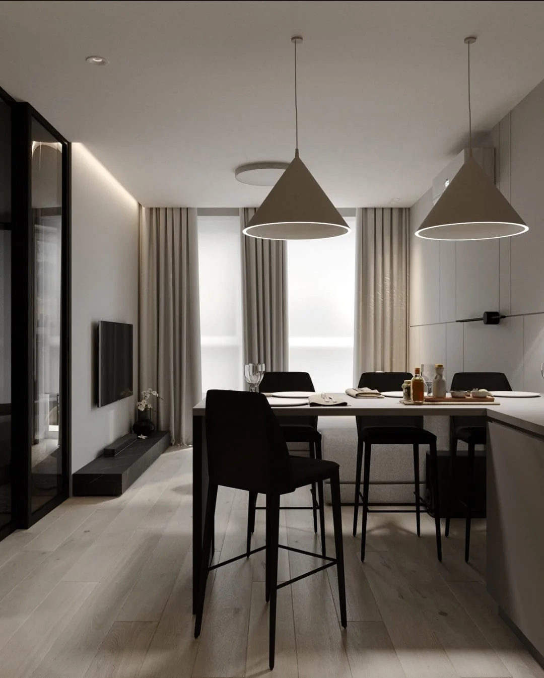 Modern dining area with black chairs at a high table, pendant lights above, large windows with curtains, a flat-screen TV on the wall, and minimal decor.