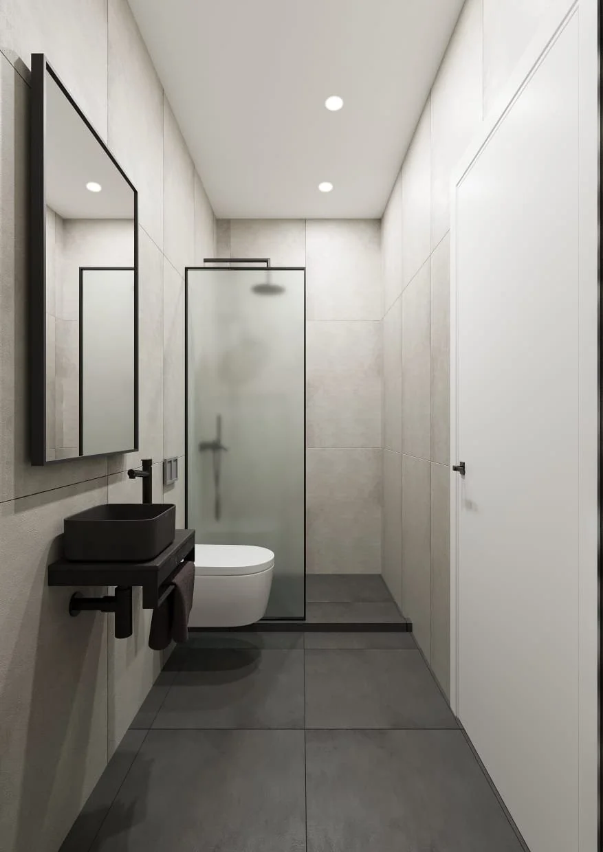 Modern minimalist bathroom with a black wall-mounted sink, a rectangular mirror, a white toilet, and a frosted glass shower enclosure, featuring neutral tones and recessed lighting.
