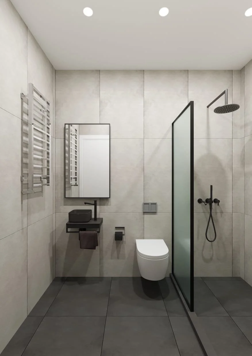 Modern bathroom with a toilet, black sink with a towel, mirror, towel rack, glass shower partition, and black fixtures in neutral tones.