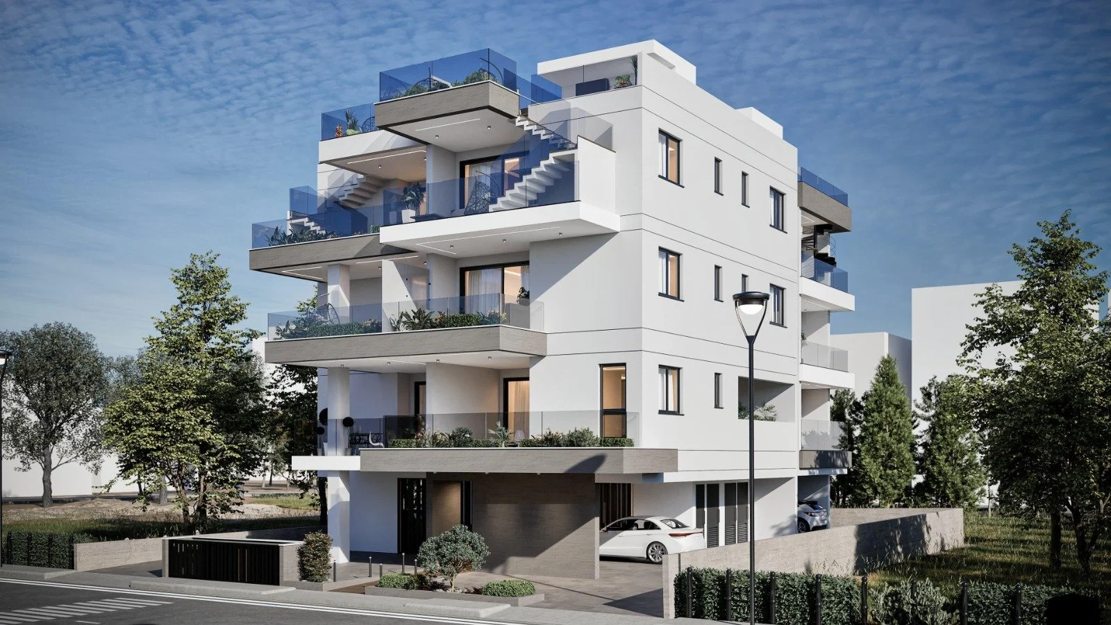 Modern multi-story apartment building with balconies, surrounded by trees, with cars parked in the garage and a lamppost in front. Greece, Investment, Golden Visa, Real Estate, Cyprus, Georgia, Lebanon, LPI, Athens.