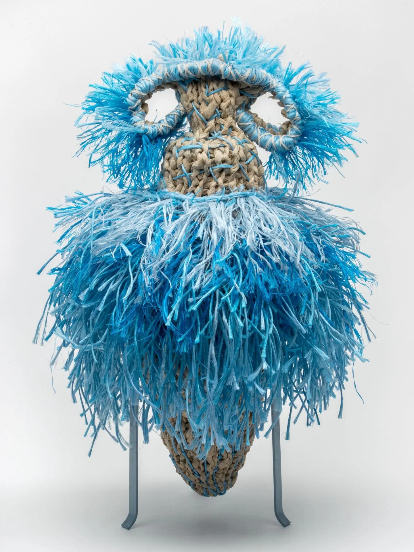 Blue Dancer. 2026. 38H x28W x26D. This sculpture was one that began a  shake-up of my world and brought a rainbow of color into my studio. As previously mentioned in posts, my textile work centers on finger knit discarded factory dressmaker&rsquo;s p