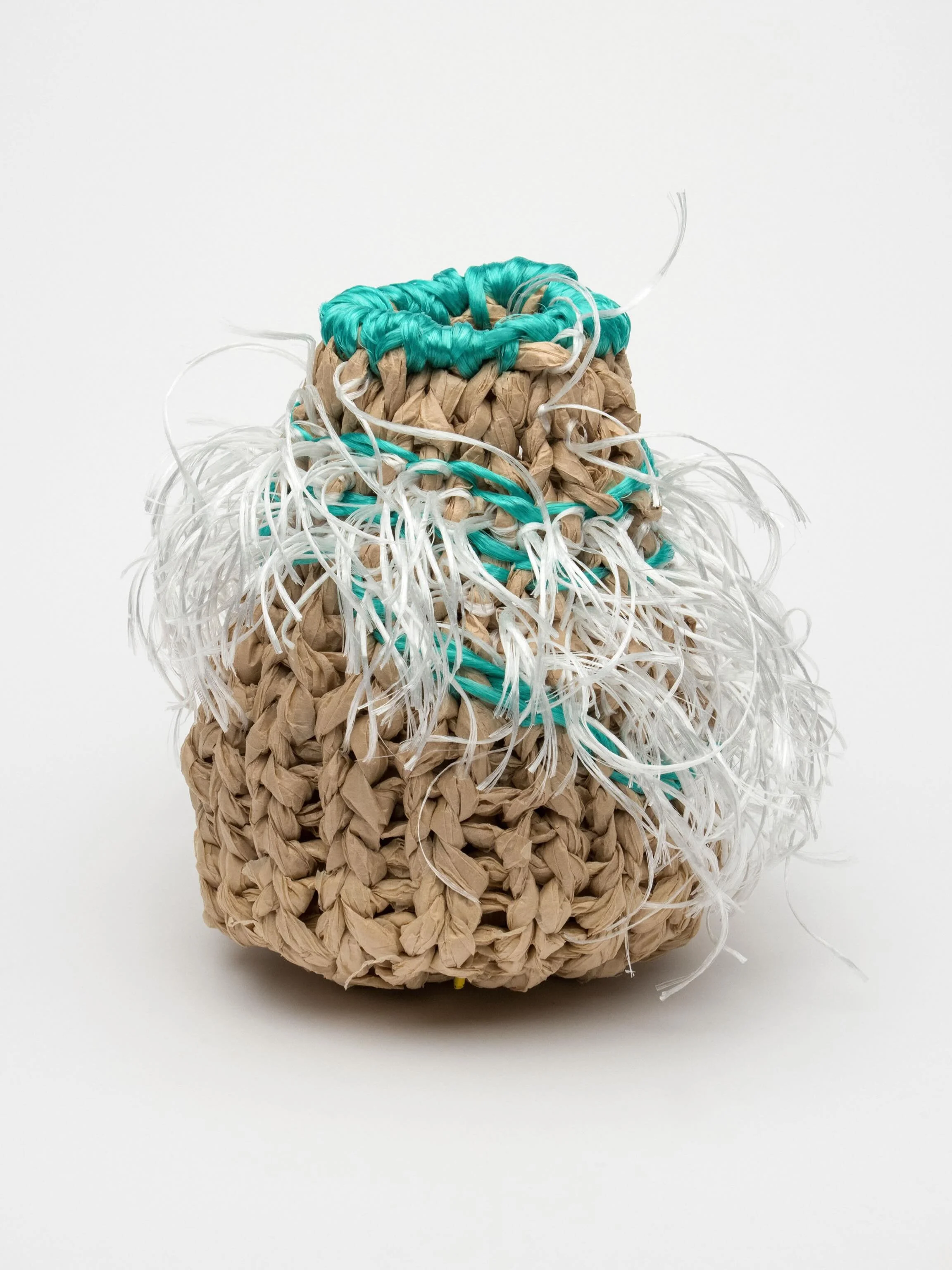 Green Fluffy. 2026. 13H x13W x13D. This vessel is part of my plunge into working with color. Easing-in really. I have been testing my comfort level by adding one-or 2 colors at a time. I am somewhat limited in which colors I work with as the twine/ba