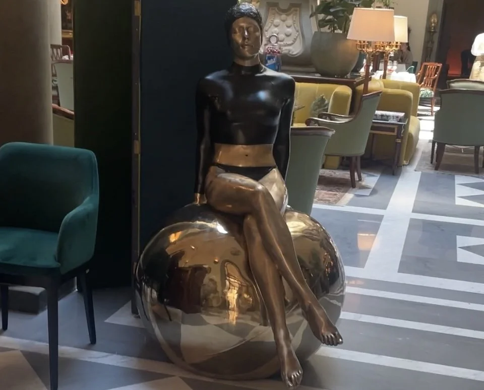 A modern art installation featuring a sculpture on a golden sphere becomes a striking focal point in the historic lobby in Florence. This project bridges Renaissance heritage with contemporary hospitality design,integrating art, furniture, and light